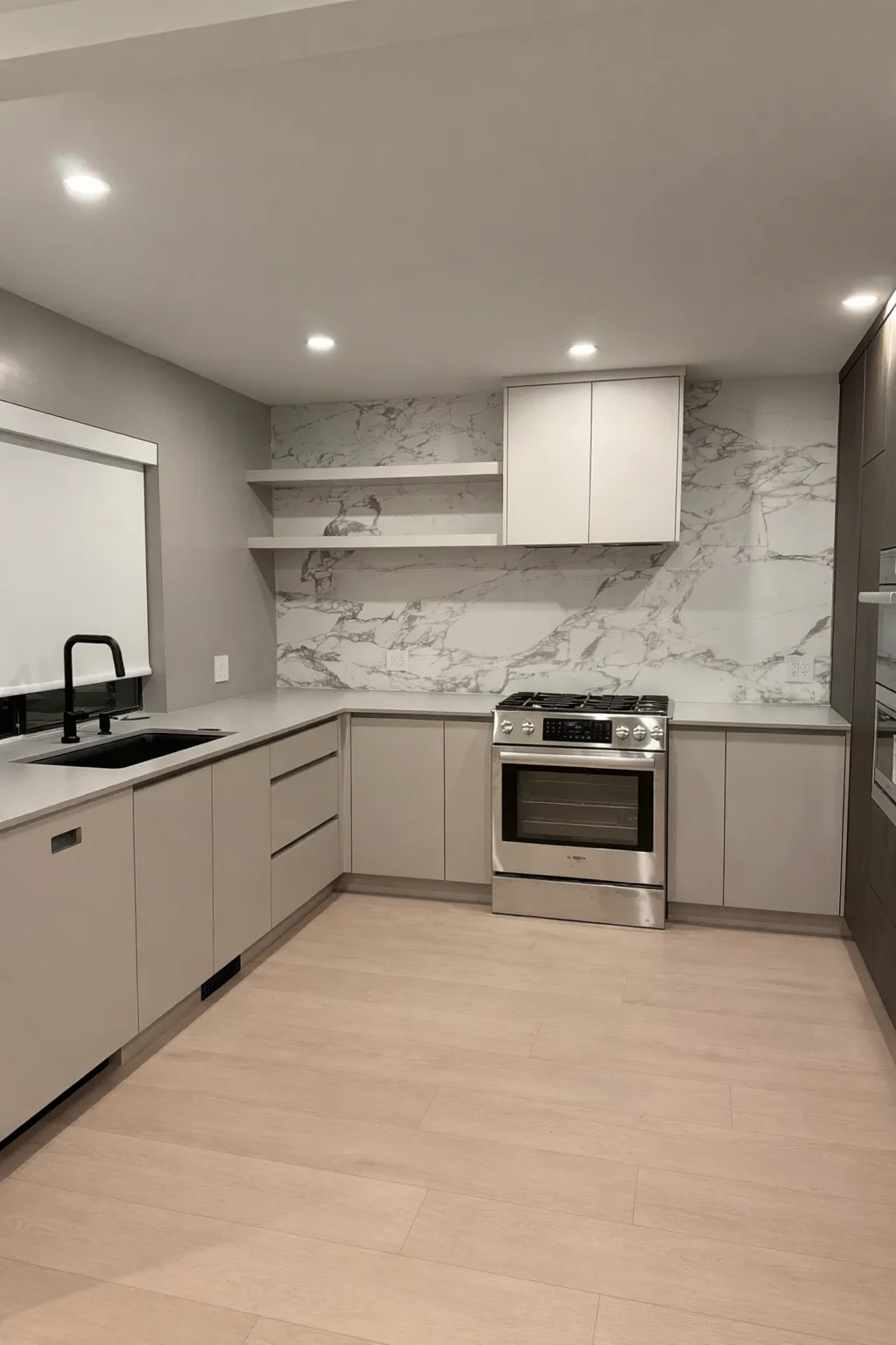 Condo Two-Tone Oak Kitchen — Gray, white, and dark oak cabinetry finishes paired with a full-height stonework for a modern elegance feel.