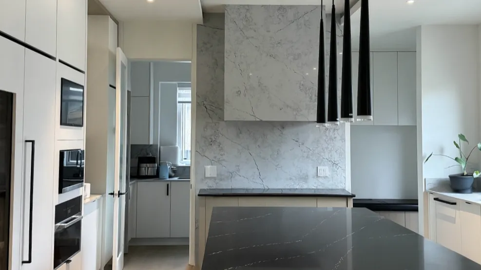 Custom white oak and stone kitchen cabinetry in a Vancouver home