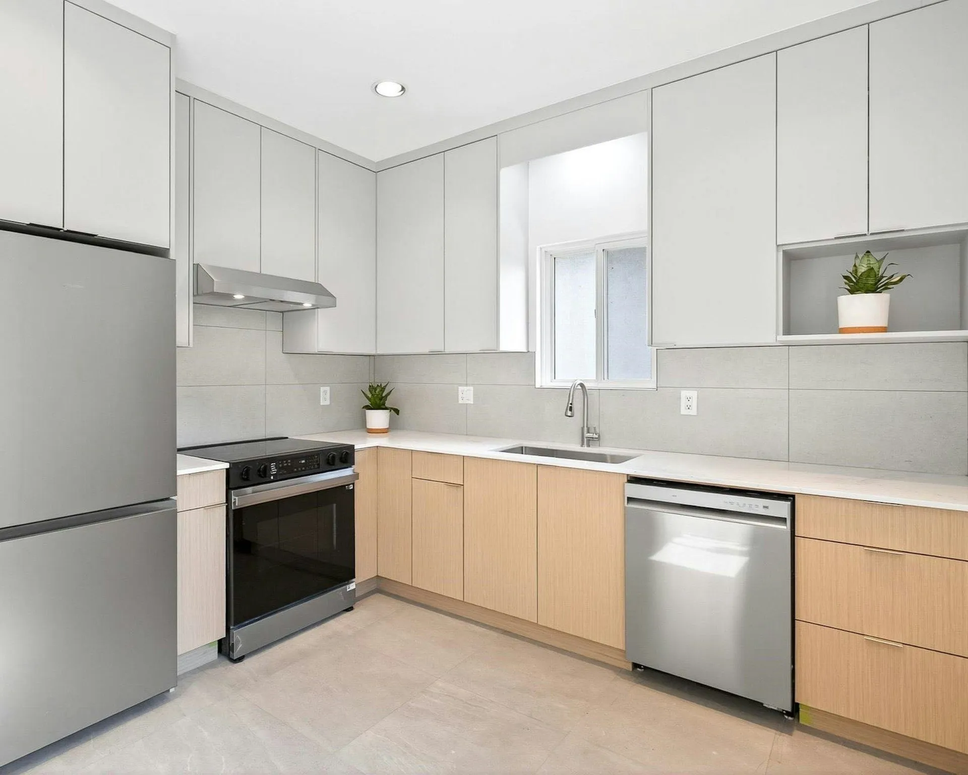 Warm Grey Flat-Panel Kitchen — A clean, functional kitchen featuring flat-panel cabinets, warm wood tones, and a bright, open layout.