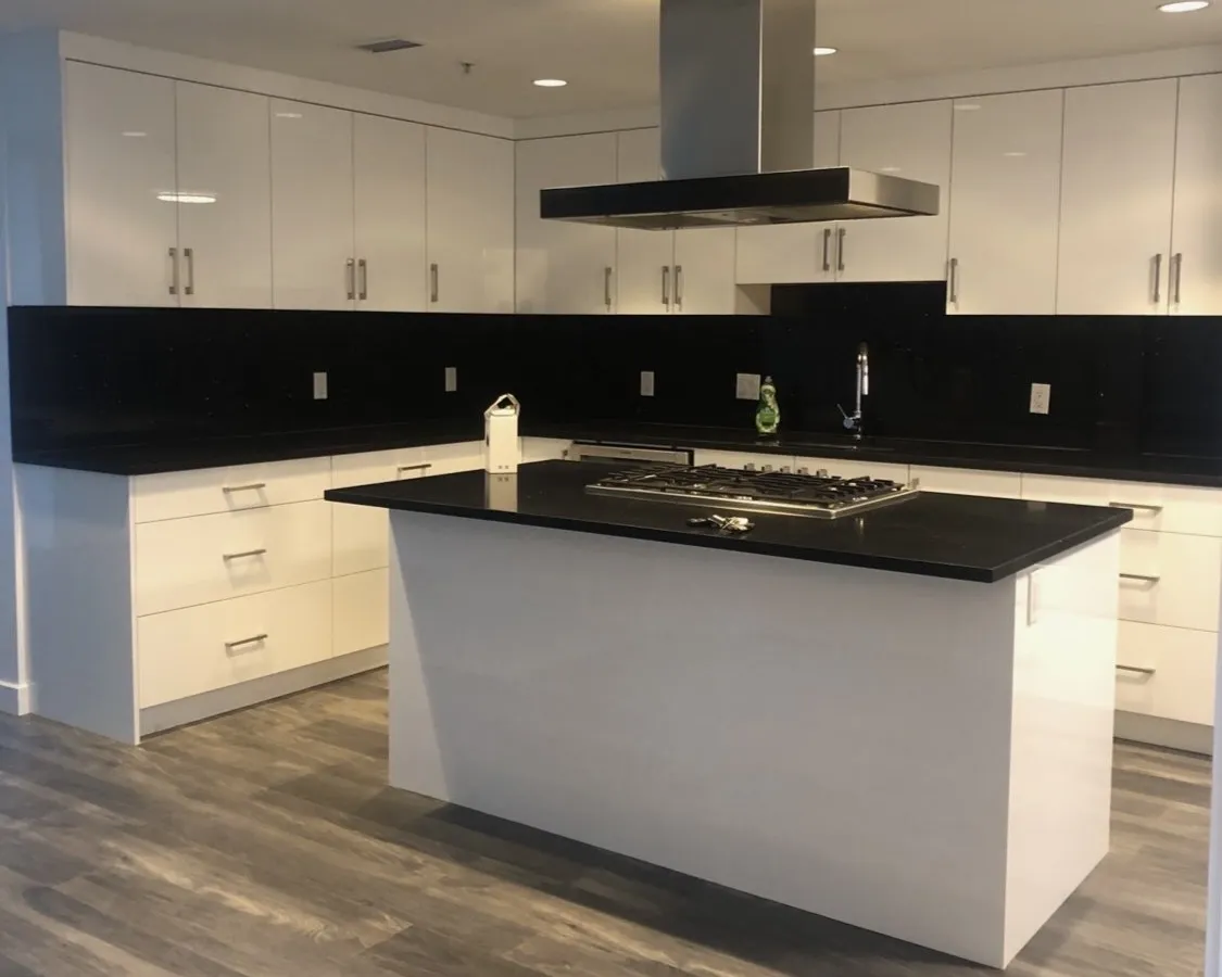 Chef's Island Kitchen — A modern kitchen where the focus is on the over-the-island range hood for great culinary execution.